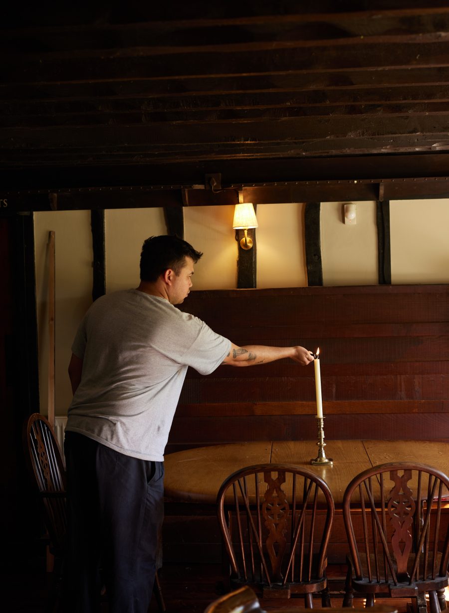 staff member arranging table in pub